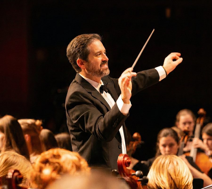 Christopher Cinquini conducting a student orchestra